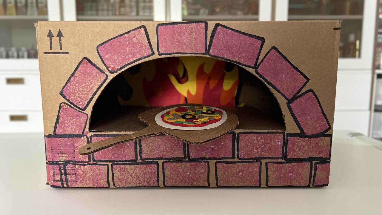 Teach Kids About Sustainability By DIY'ing a Cardboard Brick Pizza